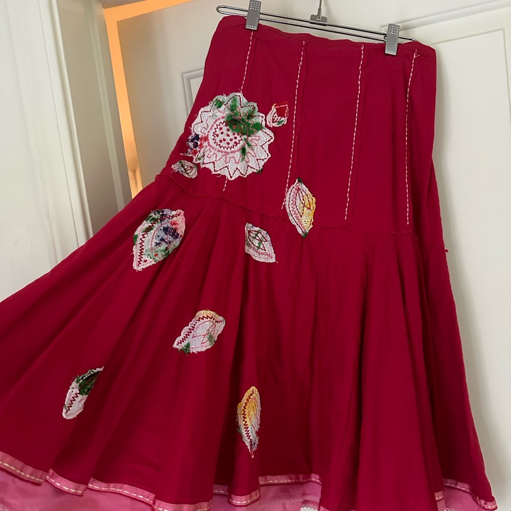 Beautiful red and pink skirt with flowers and stitching